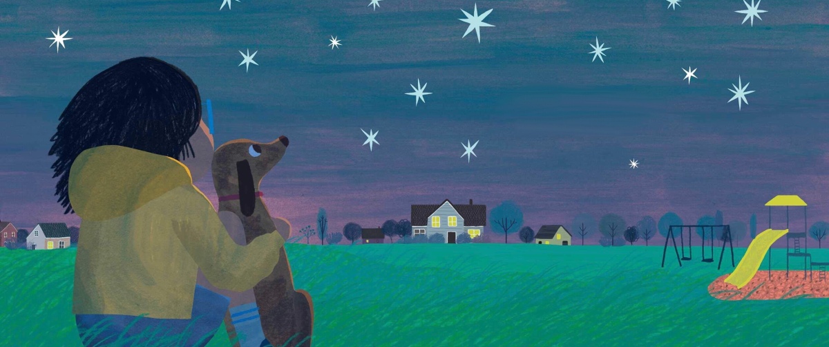 Child and dog enjoy a starry night at the playground