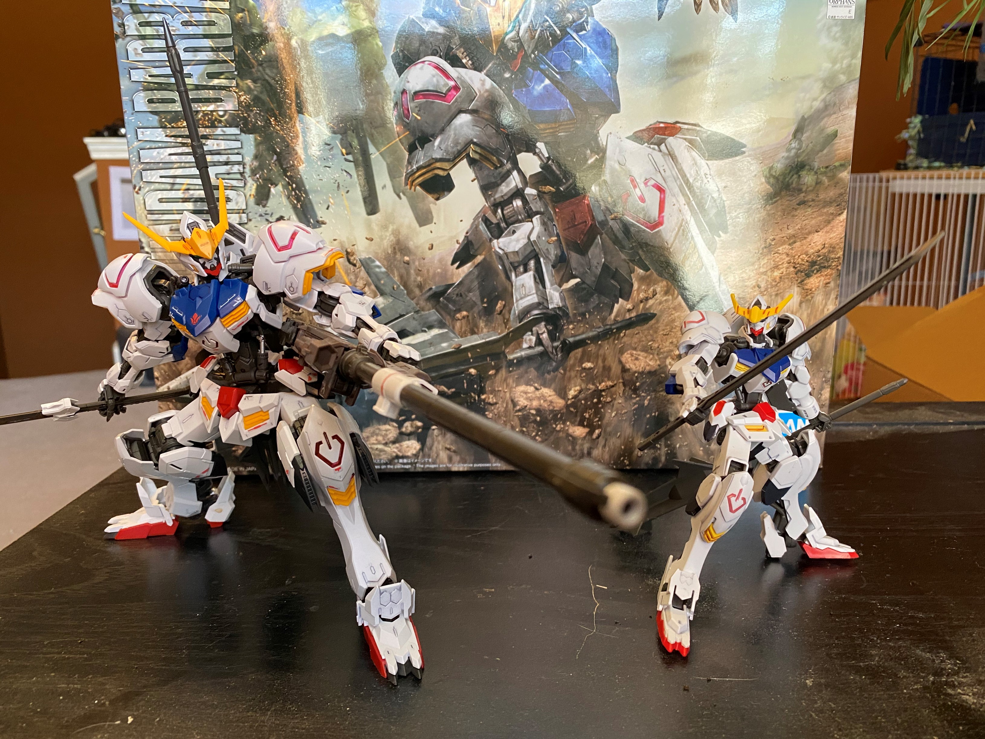 A Master Grade (left) and High Grade version of the ASW-G-08 Gundam Barbatos Gunpla